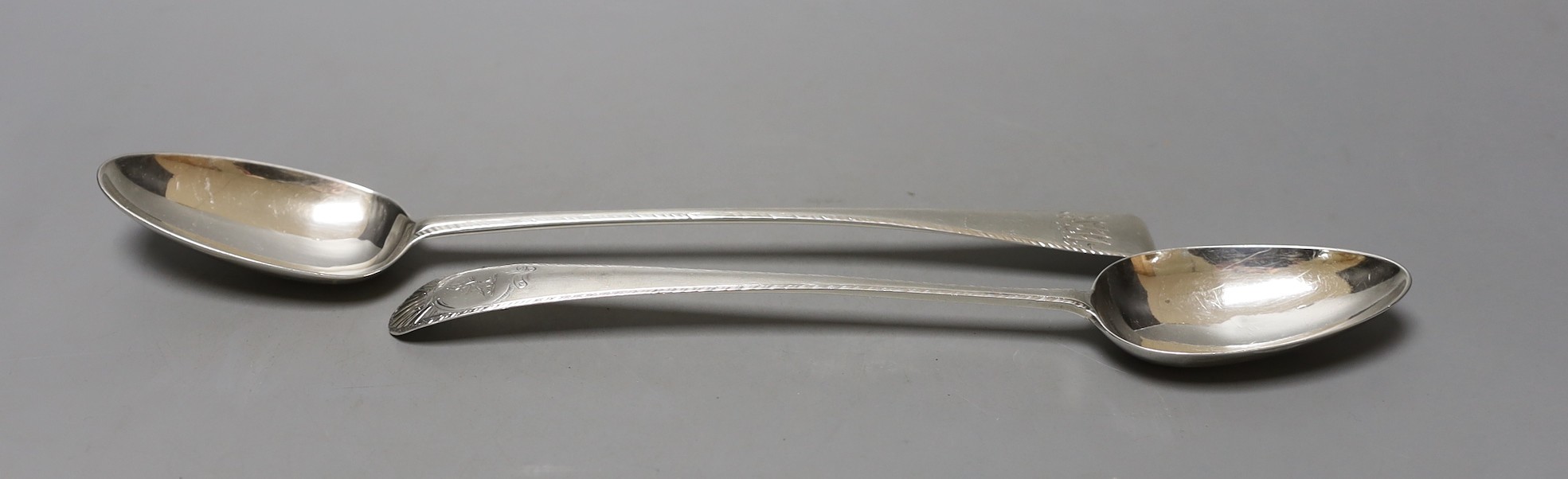 Two late 18th century Irish silver Old English feather edge basting spoons, one by James Keating and one dated Dublin, 1777, largest 31.3cm, 194 grams.